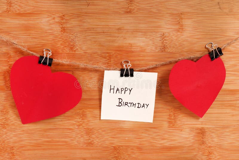 Happy birthday. Beautiful shot of happy birthday written on paper while hanging on thread royalty free stock photos Happy birthday. Beautiful shot of happy birthday written on paper while hanging on thread royalty free stock photos