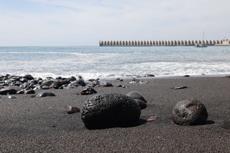 Beautiful shot of rocks on the sandy Black Beach on La Palma Canary Islands. A beautiful shot of rocks on the sandy Black Beach on La Palma Canary Islands