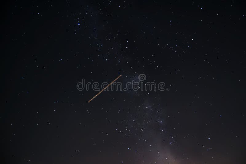 Beautiful Shot Of A Shooting Star In A Starry Night Sky Stock Photo