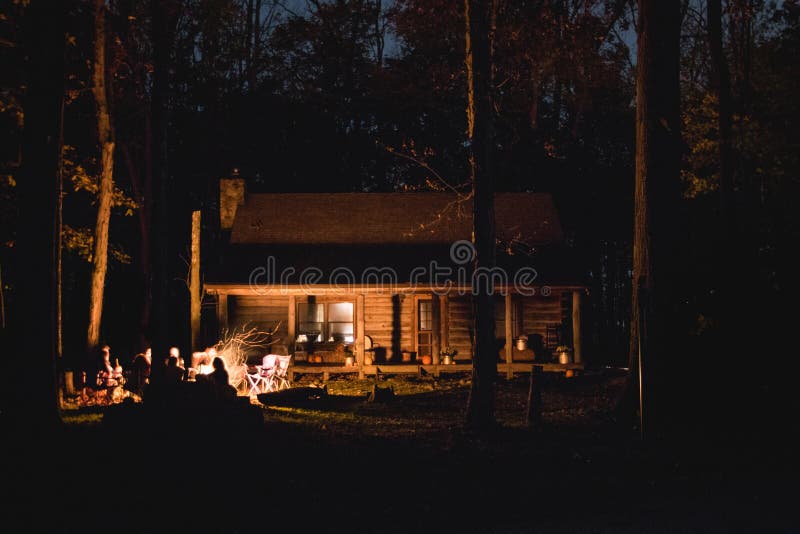 Beautiful Silhouette Shot Of Wooden Cabin In The Woods