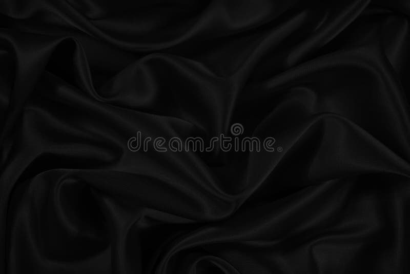 Smooth black cloth background folds. Black background abstract