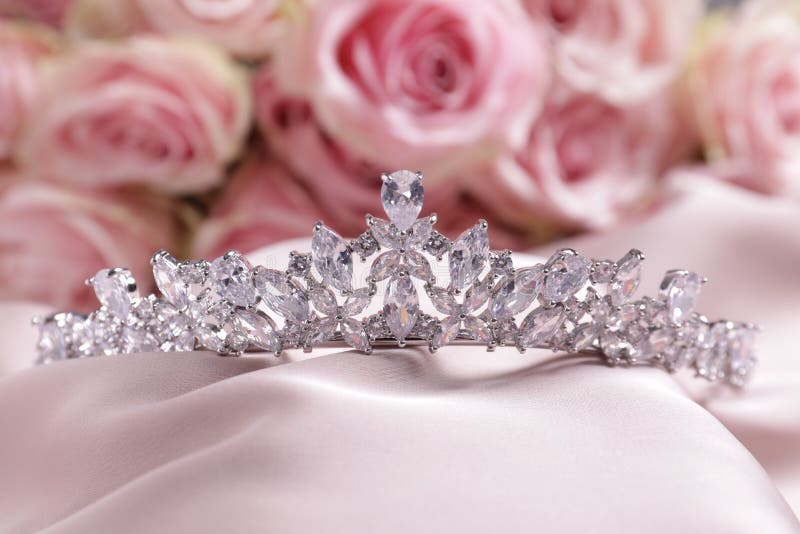 Beautiful Silver Tiara with Diamonds on Pink Silk Cloth Stock Image