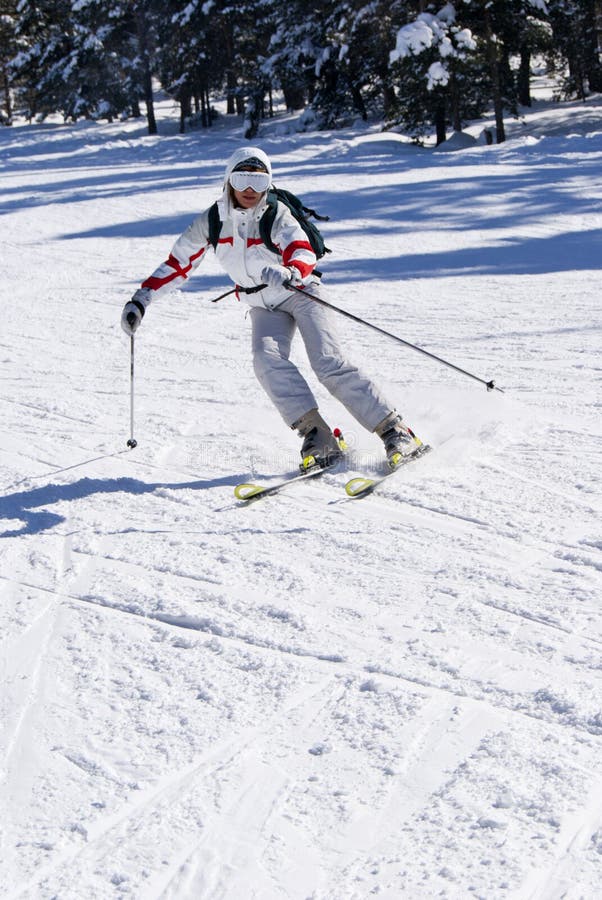 Beautiful skier skiing on the slope