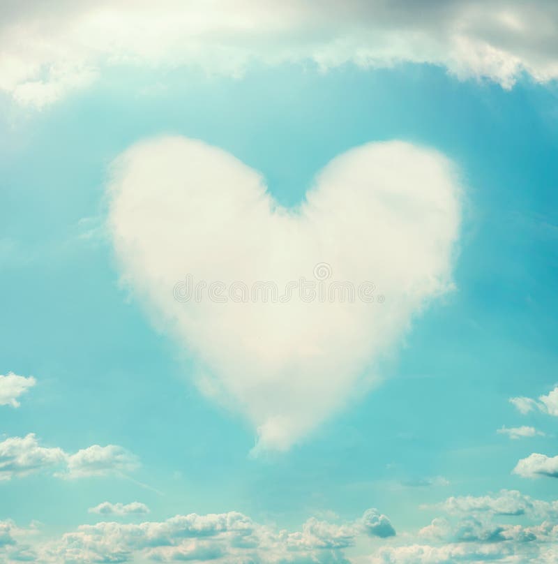 Beautiful sky with clouds shaped heart