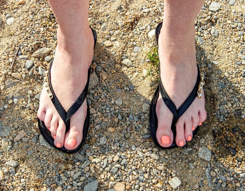 Beautiful Slates Flip Flops on Women`s Feet on the Beach Stock Photo ...