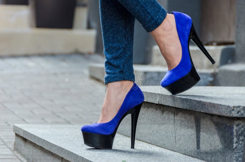 Beautiful Slender Female Legs in Tight Jeans and Blue Velvet High ...