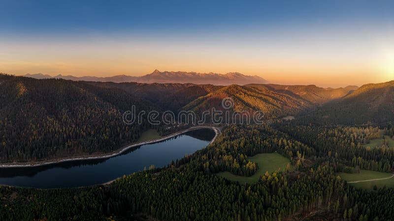 Beautiful landscape with valleys, lakes and rivers in High Tatras in fog