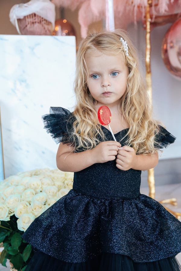 Beautiful Small Girl with Blond Curly Hair in Elegant Dress Celebrating ...