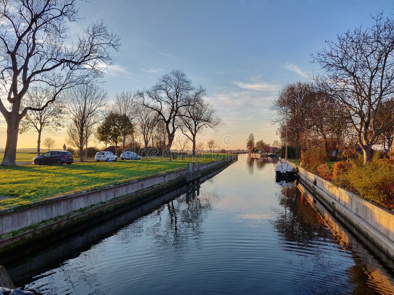 A small river canal during sunset in Nijelamer, Netherland stock photography