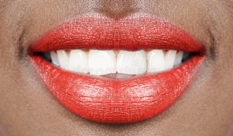 Beautiful smile african woman mouth lips with red lipstick and white teeth