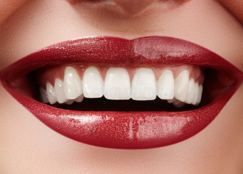 Beautiful smile with whitening teeth. Dental photo. Macro closeup of perfect female mouth, lipscare rutine stock images Beautiful smile with whitening teeth. Dental photo. Macro closeup of perfect female mouth, lipscare rutine stock images
