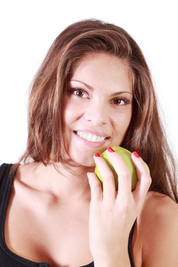 Beautiful smiling girl holds green apple