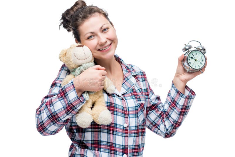 Beautiful smiling girl in plaid pajamas with a bead royalty free stock photo Beautiful smiling girl in plaid pajamas with a bead royalty free stock photo