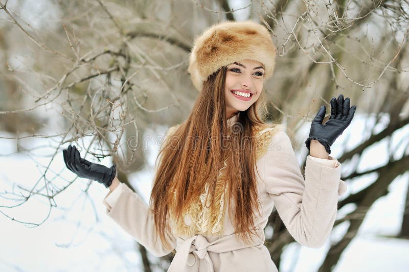 Winter Girl Portrait. Beautiful Smiling Woman in Snowy Park Stock Photo ...