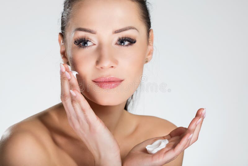Beautiful Smiling Woman Applying Cream on Face Stock Photo Image of bodycare, health 94875562
