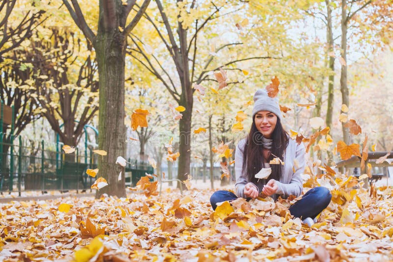 Beautiful smiling woman in autumn park stock photo Beautiful smiling woman in autumn park stock photo