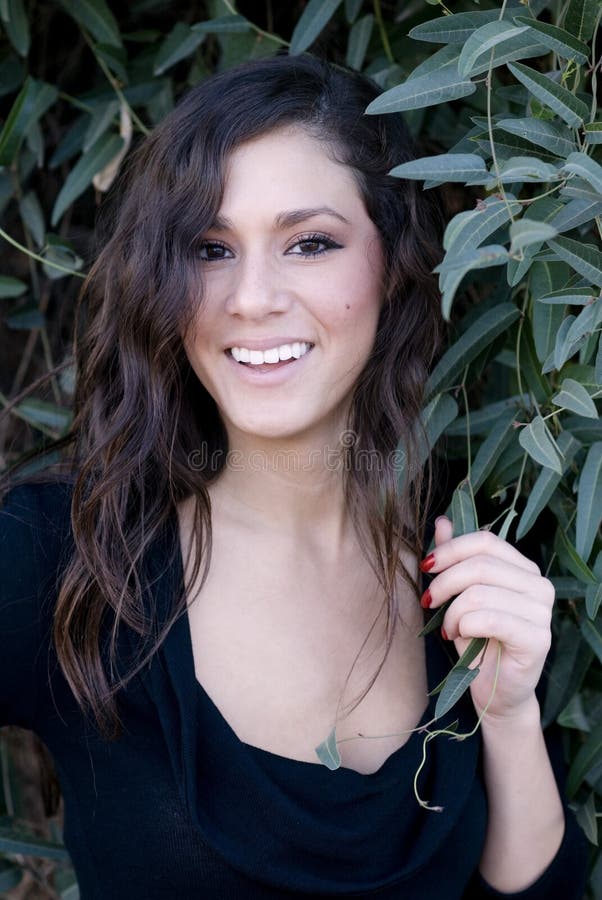 Beautiful smiling woman in black dress