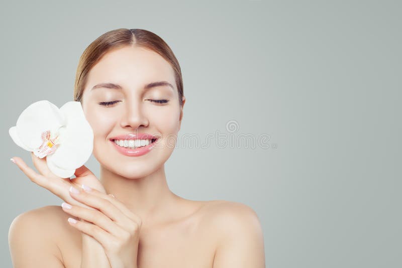 Beautiful smiling woman with healthy skin