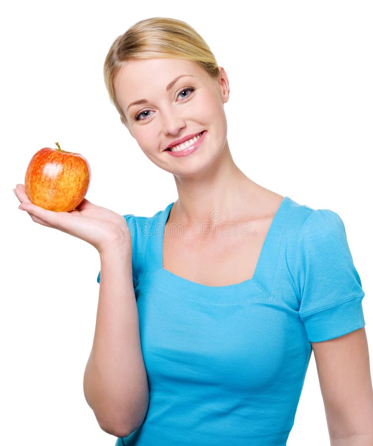 Beautiful smiling woman with a red apple