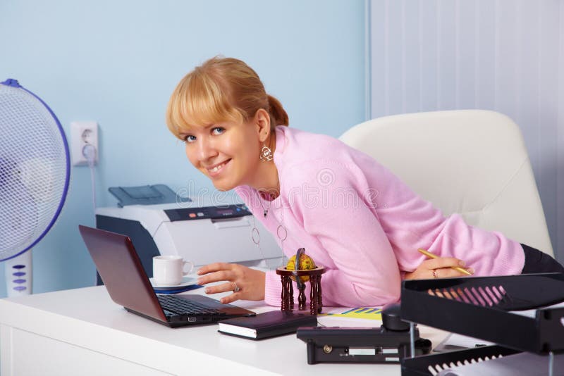 Beautiful smiling young girl in office royalty free stock images Beautiful smiling young girl in office royalty free stock images