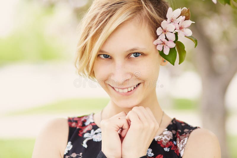 Portrait Of A Beautiful Smiling Young Woman In Glasses On A Bench In A 