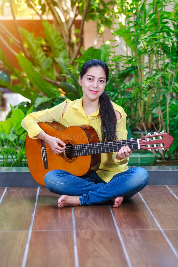 Beautiful songwriter writing on note paper with acoustic guitar stock photos Beautiful songwriter writing on note paper with acoustic guitar stock photos