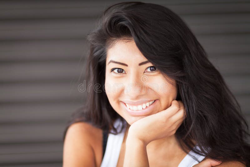 Beautiful Spanish Woman Smiling and Relaxing. Isolated Stock Image