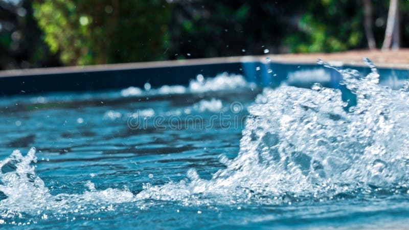 Beautiful splashed water in a swimming pool royalty free stock image