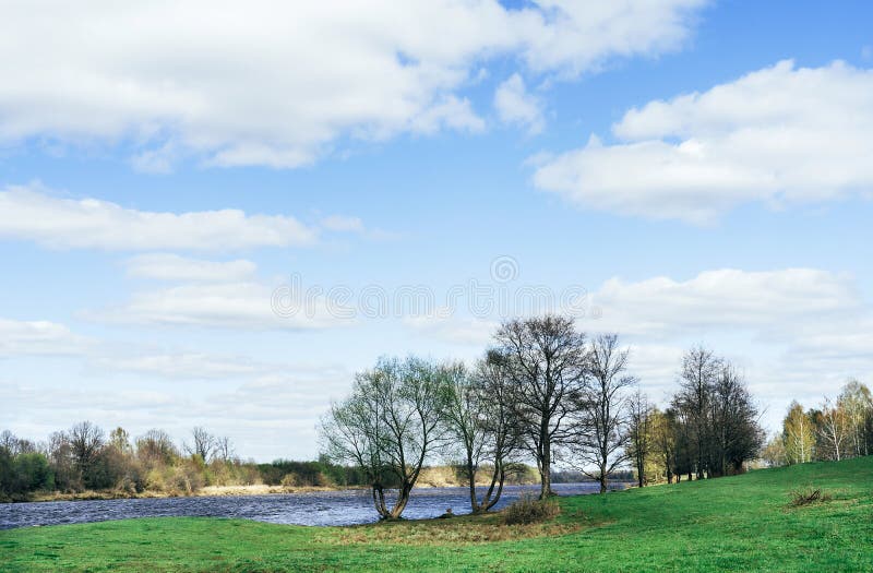 Beautiful spring landscape. Blue river and trees on on a sunny day after melting snow. stock image Beautiful spring landscape. Blue river and trees on on a sunny day after melting snow. stock image