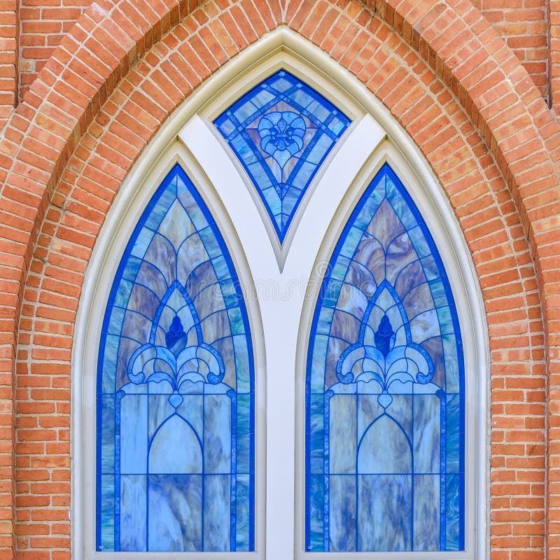 Beautiful stained glass window of a brick building