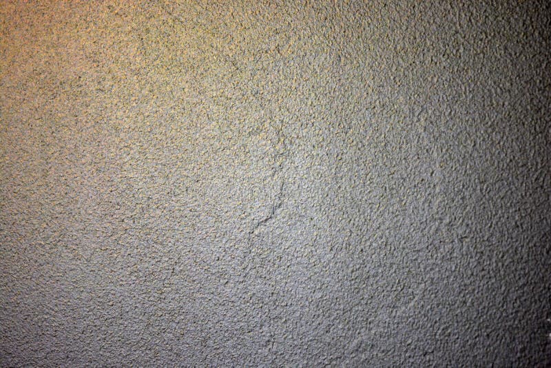 A Beautiful Structural Light Gray Wall with Golden Highlights. Stock