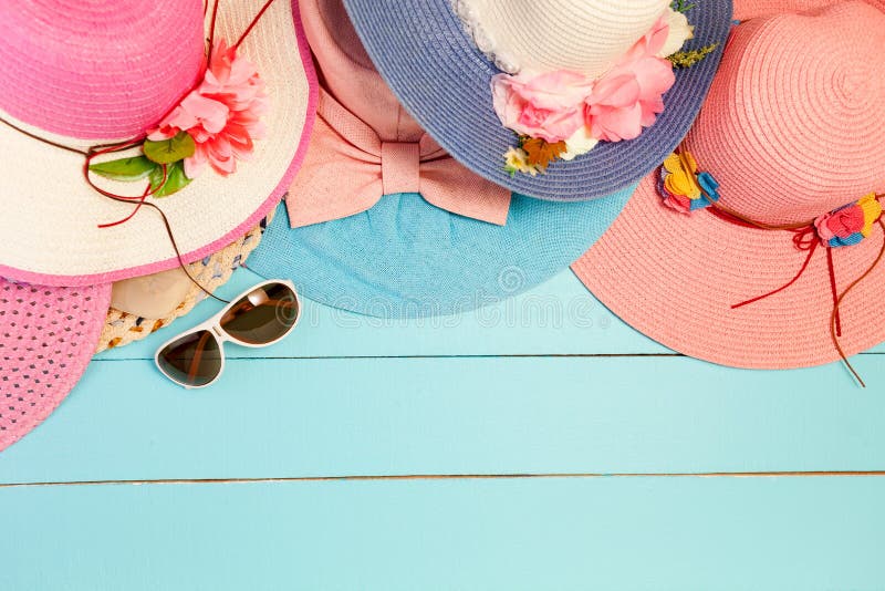 Beautiful Summer Hats with Lady Sunglasses on Blue Wooden Background ...