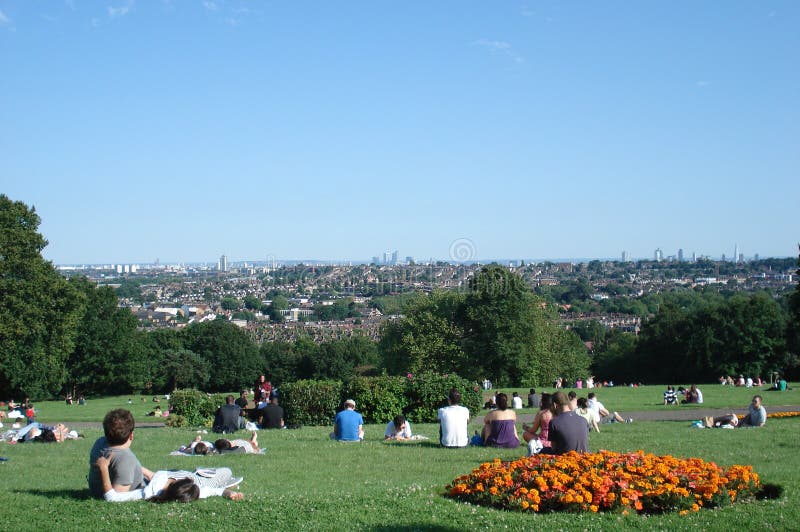 People relaxing on the lawn at park in London stock image People relaxing on the lawn at park in London stock image