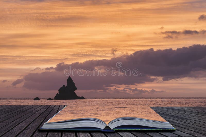 Stunning sunrise landsdcape of idyllic Broadhaven Bay beach on Pembrokeshire Coast in Wales in pages of imaginary story book. Stunning sunrise landsdcape of idyllic Broadhaven Bay beach on Pembrokeshire Coast in Wales in pages of imaginary story book