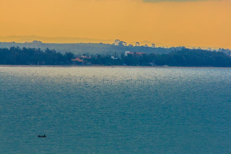 Beautiful sunrise over the sea in the morning on cloudy day that sun beams break through the clouds. Sun beaming through clouds wi royalty free stock image Beautiful sunrise over the sea in the morning on cloudy day that sun beams break through the clouds. Sun beaming through clouds wi royalty free stock image