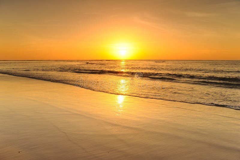 Beautiful sunset above the sea on the beach royalty free stock image