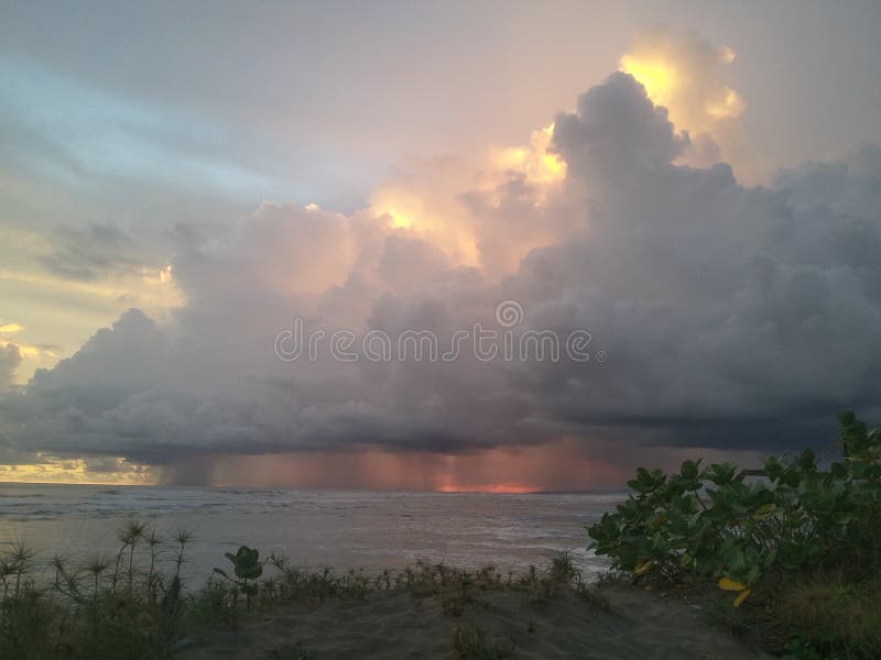 the location of the image is on the south coast of Java Island. precisely in Cipatujah Beach  Tasikmalaya Regency  West Java Province Indonesia. a rare sight when the sun is setting and the sea is raining. there are no words to describe its beauty. the location of the image is on the south coast of Java Island. precisely in Cipatujah Beach  Tasikmalaya Regency  West Java Province Indonesia. a rare sight when the sun is setting and the sea is raining. there are no words to describe its beauty.