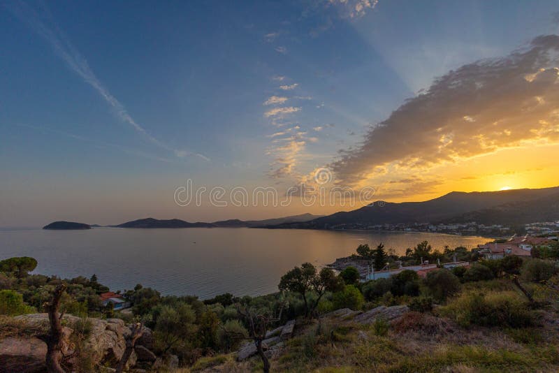 Beautiful sunset over the coastal town. stock photos