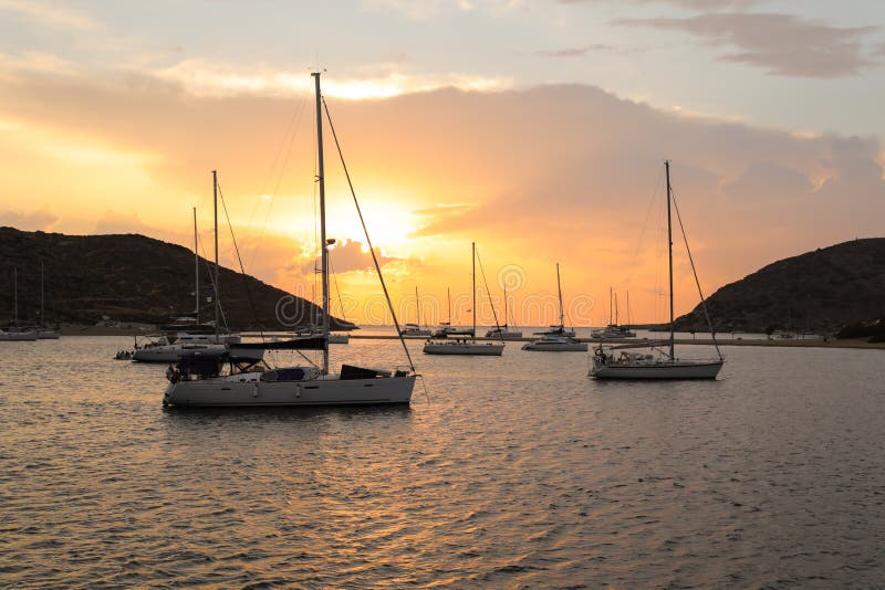 Beautiful sunset and sailboats in Kolona double bay Kythnos island Cyclades Greece. royalty free stock photos Beautiful sunset and sailboats in Kolona double bay Kythnos island Cyclades Greece. royalty free stock photos