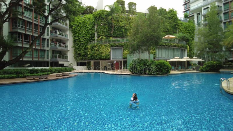 beautiful swimming pool in the condominium, Singapore,outdoor, summer, exterior, sunny, leisure, holiday, aerial
