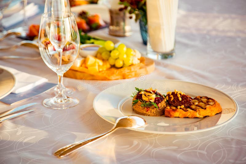 Beautiful Table Setting, with Dishes, Food, in a Summer Cafe Stock
