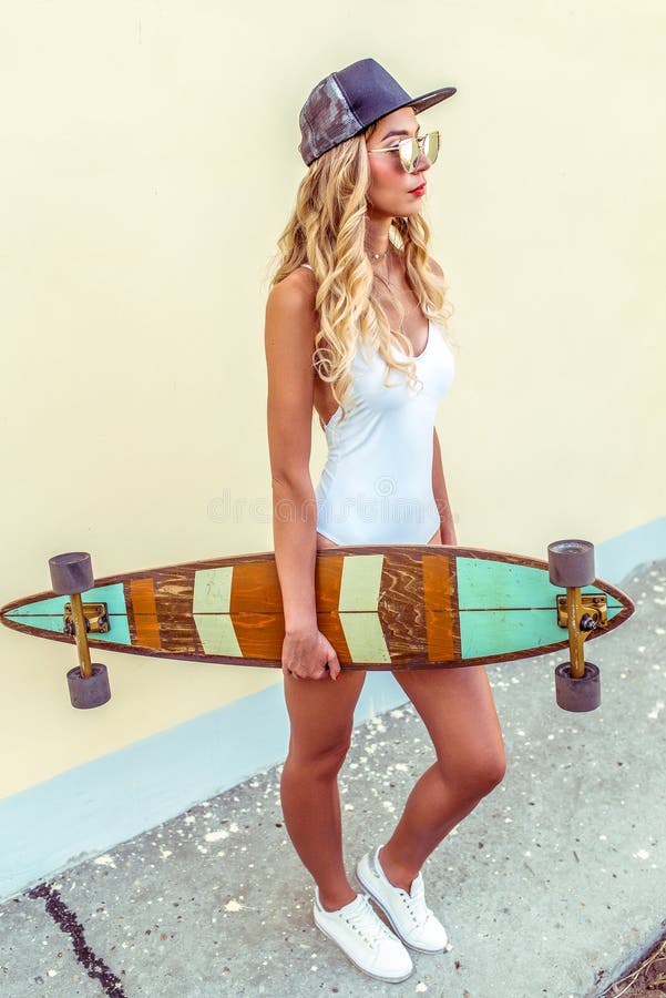 A Beautiful Tanned Woman in White Swimsuit Bodysuit, Summer in City ...