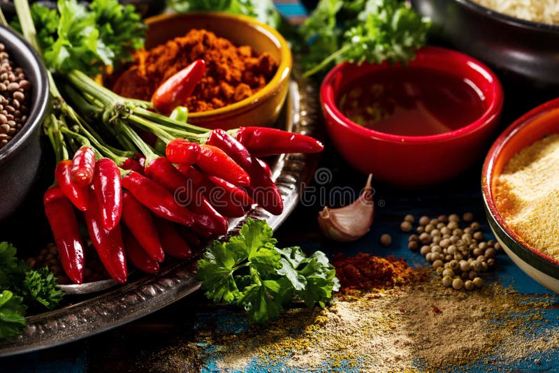 Beautiful Tasty Appetizing Ingredients Spices Grocery for Cooking Healthy Kitchen. Blue Old Wooden Background Closeup. stock photo Beautiful Tasty Appetizing Ingredients Spices Grocery for Cooking Healthy Kitchen. Blue Old Wooden Background Closeup. stock photo