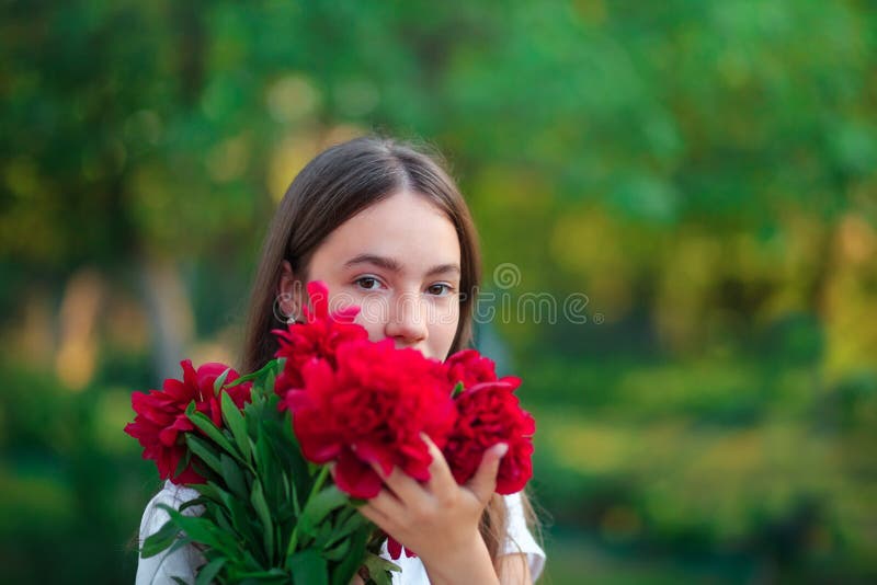 Beautiful Teen Girl is Looking at the Camera and Smiling at the Park in ...