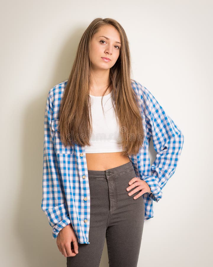 Beautiful Teen Girl in a White Top and Blue Shirt