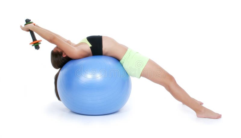 Beautiful Teen Girl In Workout Clothes On Exercise Ball with hand weights. Shot with the Canon 20D.