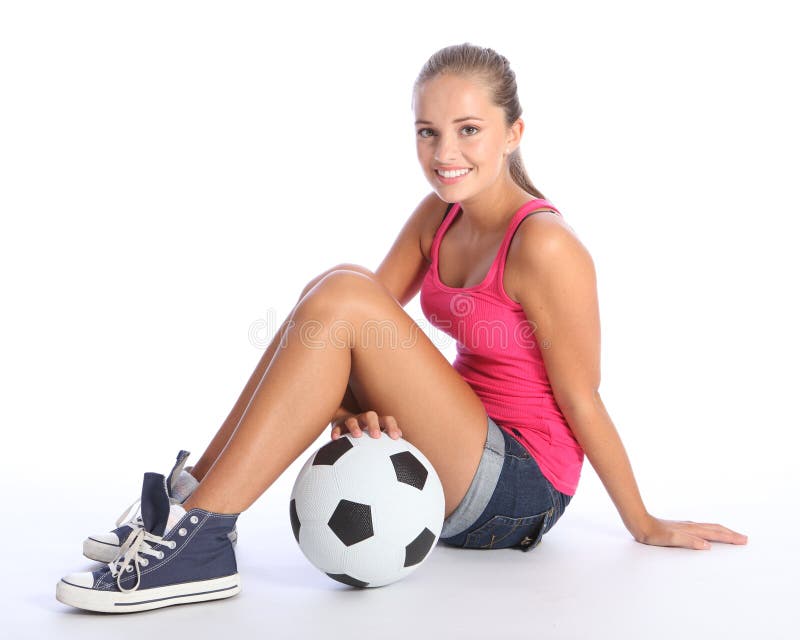 Beautiful teenage student girl with soccer ball