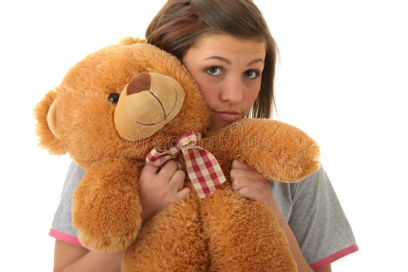 Beautiful teenager holding a teddy bear