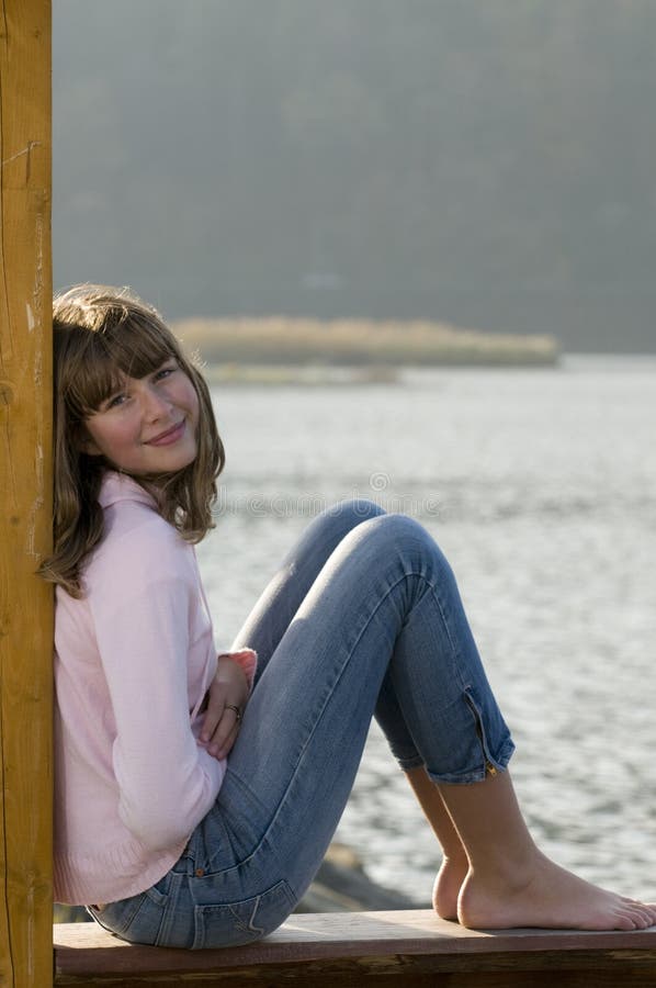 Beautiful teenager over lake