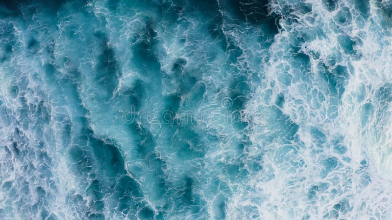 Beautiful texture of big power dark ocean waves with white wash. Aerial top view footage of fabulous sea tide on a